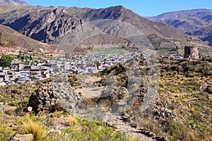 View of pre-Incan ruins and Chivay town in Peru photo