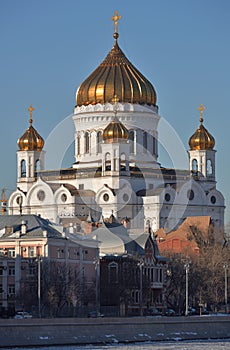 View of Prechistenskaya embankment and Cathedral of Christ Saviour  in early spring on sunny day, Moscow, Russia