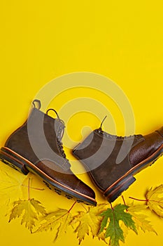 View of Premium Dark Brown Grain Brogue Derby Boots Made of Calf Leather with Rubber Sole Placed With Maple Leaves