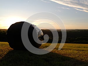 View of the preseli mountains at dusk with hay bal