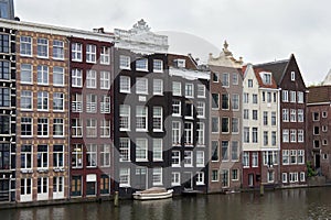 View from the Prins Hendrikkade street in Amsterdam to the old historical dutch buildings. photo