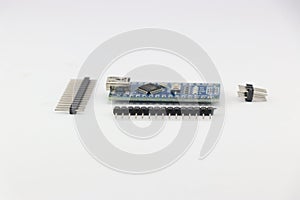 View of a programmable micro controlled board with the pins unsoldered isolated on white background