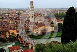 View of the promenade, the Ponte Pietra bridge over the Adige river and the Cathedral in Verona, Italy