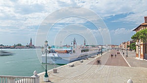 View of the promenade Riva degli Schiavoni timelapse with tourists in San Marco of Venice in Italy.