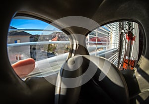 View through protective mask and window on empty city