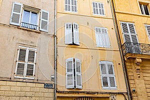 View of provence typical city Aix en Provence with old house facade in the morning