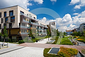 View of public park with newly built modern block of flats