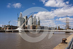 View at Puerto Madero with a white modern bridge and tall ship, Buenos Aires, Argentinaa photo