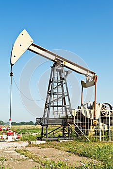 View of pumpjack pumping oil