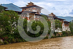 View of Punakha Dzong located next to Mo Chhu river in Bumthang district of Bhutan, view of ancient building in Bhutan.