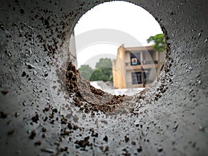 A view from a pvc pipe on the rainy day