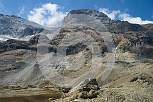 view of the pyrenean \'Cilindro\' peak and glacier from the MarborÃÂ© or Tuca Roya valley, vertical photo photo