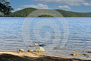 a view of the quabbin reservoir on a summers day