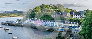 A view of Quay street in portree with port and boats