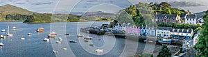 A view of Quay street in portree with port and boats