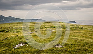 A view of Quirang hiils in the distance from the walking path from Staffin village to Staffin harbour and An Corran Beach