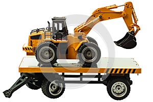 View of R/C model excavator and trailer on a white background. Free time Children and adults concept