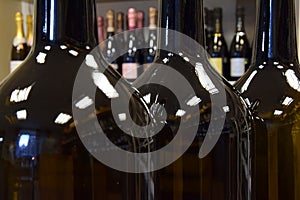 View of rack with wine bottles in a wine shop, restaurant, cafe, bar