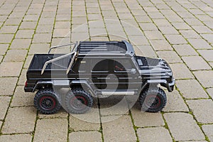 View of radio controlled model  racing car on off-road background. Toys with remote control. Free time.