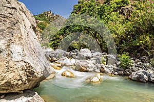 View of the Raganello River below il Ponte del diavolo pathway in Civita