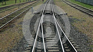 View at the rails and forks from the last wagon of running train