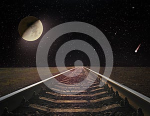 View of rails and the moon at night. Night railway road. Travel concept