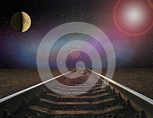 View of rails and the moon at night. Night railway road. Travel concept
