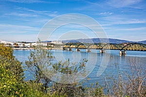 View of the railway bridge over the river Arade and the city Portimao, Portugal, Europe