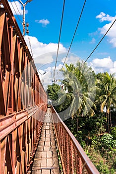View of the railway bridge. Walkway for pedestrians, Louangphabang, Laos. Vertical.