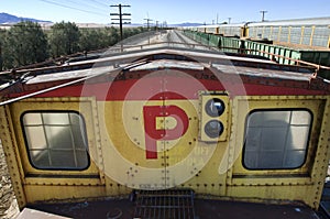 View of railyard from the top of a train.