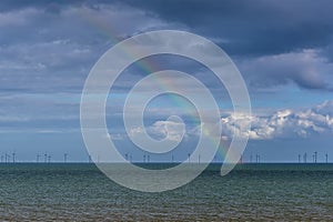 A view of a rainbow out to sea off Skegness beach, UK