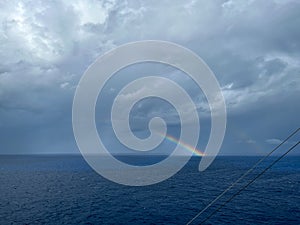 A view of a rainbow after a storm on the Caribbean Sea from a cruise ship