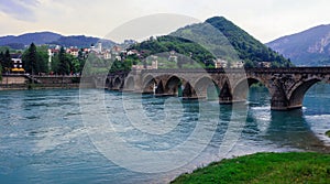 View in the Rainy Day to the historic Mehmed PaÅ¡a SokoloviÄ‡ Bridge Bridge in ViÅ¡egrad, over the Drina River