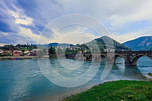 View in the Rainy Day to the historic Mehmed PaÅ¡a SokoloviÄ‡ Bridge Bridge in ViÅ¡egrad, over the Drina River