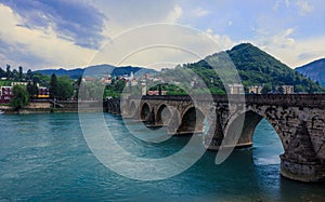 View in the Rainy Day to the historic Mehmed PaÅ¡a SokoloviÄ‡ Bridge Bridge in ViÅ¡egrad, over the Drina River