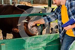 View of rancher with clipboard touching