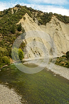 View of Rangitikei River and the surrounding cliffs as the river weaves through the lush countryside