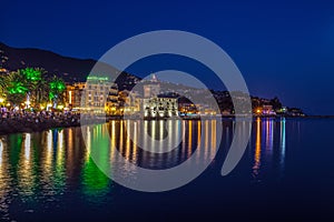 View of Rapallo, Genoa province and the castle on the sea by night, Italy