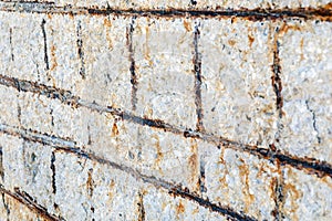 View of the rebars corrosion in the concrete. Rebar corrosion occurs when chloride ions migrate to concrete material.