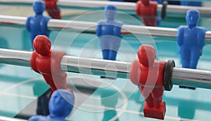 A view on red and blue plastic table football players