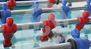 A view on red and blue plastic table football players