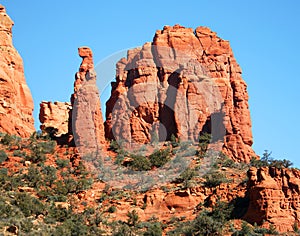 A View of Red Rocks, Blue Sky, and Green Trees