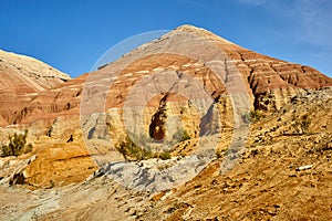 view of red sandstone mountain with traces of water erosion Altyn Emel National Park, Kazakhstan