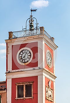 View of red and white clock tower