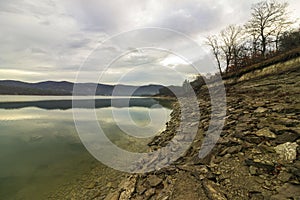 View with reflections of mountains in Ticha Dam