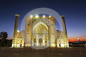 View of Registan square in Samarkand - the main square with Ulugbek madrasah at sunset.