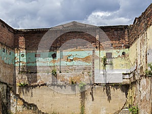 View of the remain brick walls and stairs of a demolished house