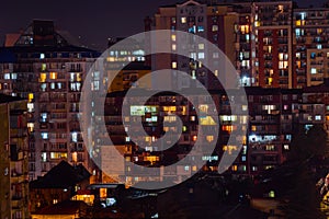 View of residential apartment building windows at night - facade view