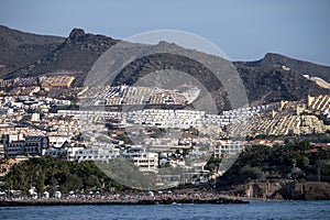 View on resorts and beaches of South coast of Tenerife island during sail boat trip along coastline, Canary islands, Spain