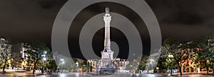 view of the Restauradores square and his obelisk at night, Lisbon, Portugal photo
